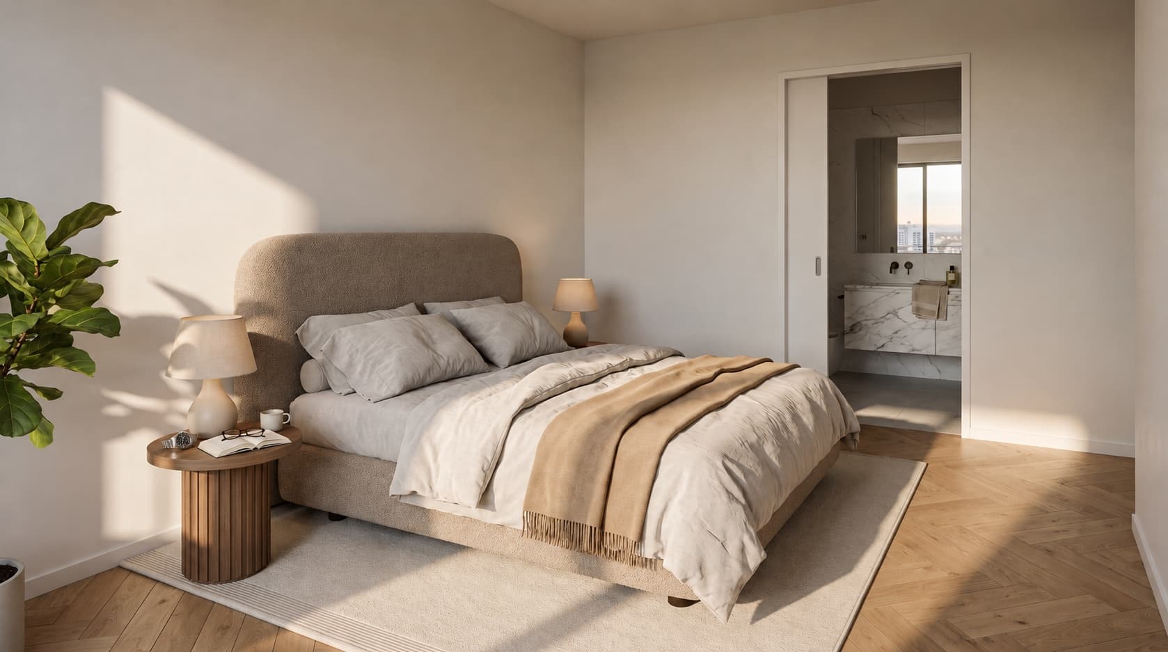 Artist impression of a bedroom in warm, low sunlight: a bed with an upholstered headboard and linen bedding, a wooden bedside table with a book and reading glasses, a herringbone oak floor, and a door to a marble bathroom with a window onto the city.
